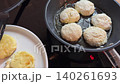 The process of frying syrniki on a frying pan on an induction stove. top view. Video with sound 140261693