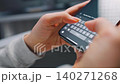 Female hands typing text on smartphone close-up. 140271268