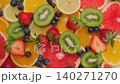 Background of fresh fruits and berries rotating. Vegan sweet food, flat lay. 140271270