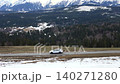 Cinematic footage of a car navigating through the winter mountain landscape 140271280