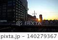 Morning Glow Over Urban Landscape. City Awakening With Sunlight Reflecting On Buildings 140279367