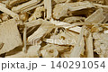 Close-up of pale wood chips and splinters in a shallow pile 140291054