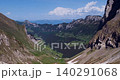 Alpine valley between steep mountain ridges 140291068