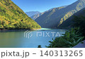 Scenic landscape view of tranquil lake with mountains on the left and right. Yunnan, China. 140313265