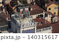 Aerial View of Historic Bell and Rooftop Statues in Sunlight 140315617