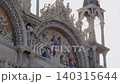 Sunlit Religious Mosaic on Saint Mark Basilica Facade in Venice 140315644