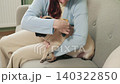 Woman Grooming Pug Dog at Home 140322850