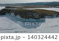 Aerial winter view of Kharantsy Island cliffs and frozen Lake Baikal, Russia 140324442