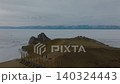 Drone view of Shamanka Rock at Lake Baikal with tourists on Olkhon Island 140324443