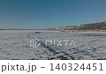 Winter aerial view of frozen Lake Baikal ice with tracks, Russia landscape 140324451