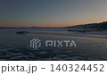 Winter sunset aerial view over frozen Lake Baikal with ice patterns, Russia 140324452