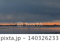 Distant Coastal City Skyline Under Gray Cloudy Sky 140326233