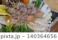 Korean Dumpling Hot Pot (Mandu-jeongol) with Beef and Fresh Vegetables Boiling in a Pot 140364656