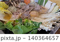 Korean Dumpling Hot Pot (Mandu-jeongol) with Beef and Fresh Vegetables Boiling in a Pot 140364657
