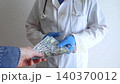 Close-up of doctor in white coat and blue gloves receiving or hiding cash. Concept of high medical salary, corruption in medicine, healthcare bribery, and expensive health insurance. Close-up of doctor in white coat and blue gloves receiving or hiding cash. Concept of high medical salary, corruption in medicine, healthcare bribery, and expensive health insurance. 140370012