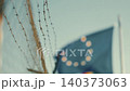 European flag behind barbed wire symbolizes borders and security issues in Europe 140373063