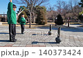 Children Enjoying Tuho, a Traditional Korean Arrow-Throwing Game, in an Outdoor Park 140373424