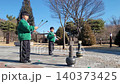 Children Enjoying Tuho, a Traditional Korean Arrow-Throwing Game, in an Outdoor Park 140373425