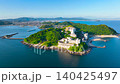 Drone aerial footage (4K) of the Nishiura Onsen and Palm Beach at the tip of the Nishiura Peninsula in Gamagori City, Aichi Prefecture. 140425497
