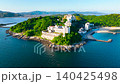 Drone aerial footage (4K) of the Nishiura Onsen and Palm Beach at the tip of the Nishiura Peninsula in Gamagori City, Aichi Prefecture. 140425498