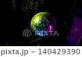 Disco ball hanging over dark night bar interior, sparkling reflections on walls and dance floor. High quality video 4k 140429390