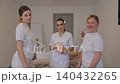 Massage school students learning facial anatomy 140432265