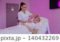 Cosmetologist applying kinesiology tape for face lifting 140432269