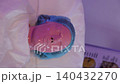 Client receiving pink alginate peel-off mask facial treatment 140432270
