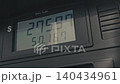 Rising gas prices on a pump meter 140434961