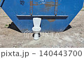 trash container with a toilet 140443700