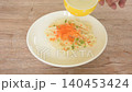 Udon or Japanese rice noodles dressing Ebiko shrimp egg dressing white cabonara onion cream sauce on plate  140453424