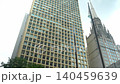 Chicago downtown skyscraper with grid window pattern and surrounding urban architecture. Cityscape scene highlighting modern buildings and vertical structure in an American city. 140459639