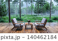 Cozy wooden deck with two armchairs and a small table on a rainy day, 3d animation render 140462184