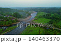 Terraced Rice Fields at Sunrise in Indonesia. Beautiful panoramic view of terraced rice fields surrounded by lush tropical greenery and palm trees 140463370