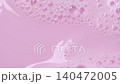 Slow motion close-up soap foam texture on pink background, white shampoo soapsud 140472005
