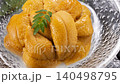 A luxurious seafood dish featuring fresh sea urchin from Hokkaido piled high in a glass bowl. 140498795