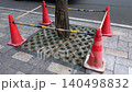 Red Traffic Cones Protecting Urban Tree on City Sidewalk Safety Barrier 140498832