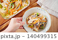 Marinated horse mackerel (Nanban-style), a pre-made dish taken from a storage container. 140499315