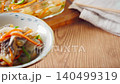 Marinated horse mackerel (Nanban-style), a pre-made dish taken from a storage container. 140499319
