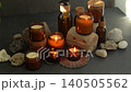 Blow out burning candles. Smoke from fading. Aroma candles in jars burn. Soy scented candle in glass. 140505562