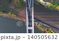 Aerial drone shot flying backward and tilting up from a top-down view of the Keel Crossing to reveal Keel Square and the modern city skyline of Sunderland at sunrise. 140505632