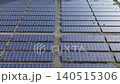 [Aerial Footage] A top-down view and grid of mega solar power plants filling the screen (Background material for renewable energy and environmental issues) 140515306