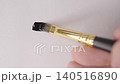 Black ink brushstroke with real brush for text overlay on textured white paper close up. 140516890