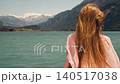 woman long hair in white swimsuit standing on shore Turquoise Azure Water 140517038