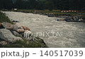 raging fast narrow mountain river in Switzerland slow motion 140517039