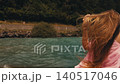 woman long hair in white swimsuit standing on shore Turquoise Azure Water 140517046