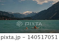 Happy young couple man and woman swimming hanging out in sea laughing hugging having fun 140517051