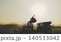 Sunny morning in Thailand, solo motorbike trip. Dawn, a bike is parked by the road. Green meadow and sun, beautiful nature of South Asia. High quality 4k footage beautiful landscape 140533042
