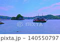 [4K Video] A sightseeing boat turning left in Shimoda Port in early summer, followed by seagulls, with a distant view of Inubashiri Island. 140550797