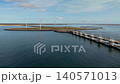 Aerial view of the Oosterscheldekering storm surge barrier with offshore wind turbines in Zeeland, Netherlands. 140571013